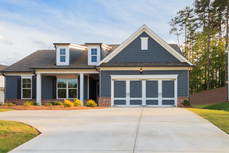 blue house with garage
